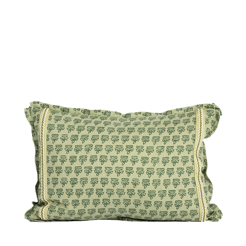 green lumbar pillow with pattern