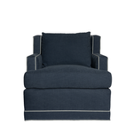 Dark blue armchair with a pillow on a white background