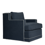 Dark blue armchair with white trim on a white background
