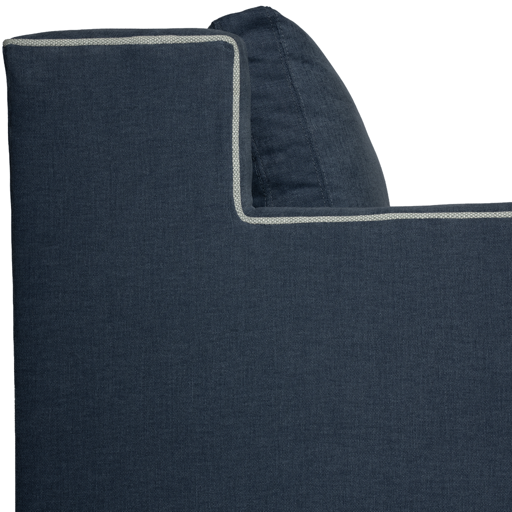 Close-up of a dark blue fabric with a light gray border on a white background