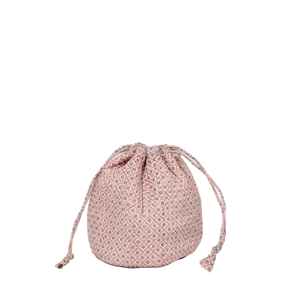 A small drawstring pouch made of pink fabric with a repeating blue and white geometric diamond pattern, shown against a plain white background.