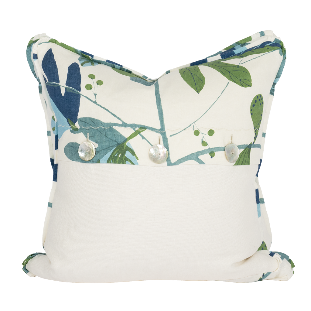 back of white pillow with leaves