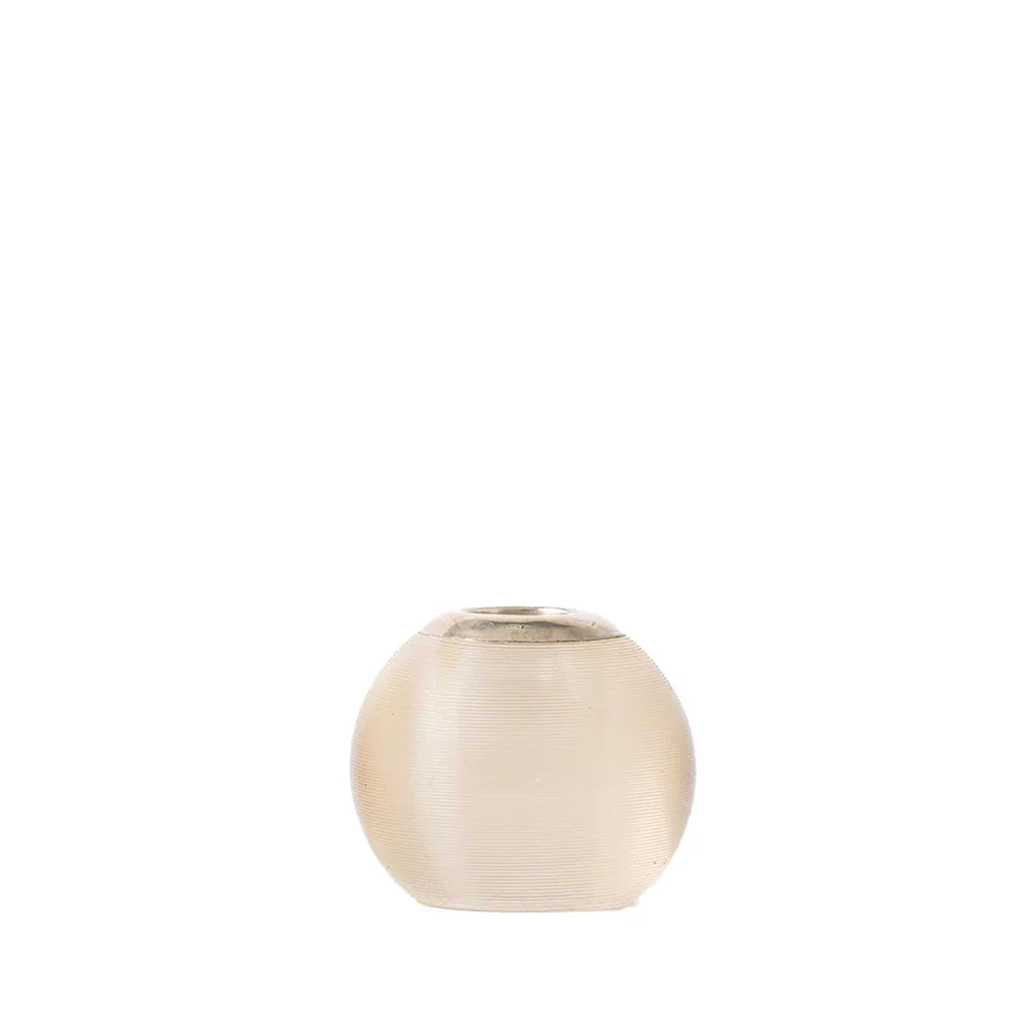 A small round glass vase with a textured, frosted finish in a warm cream or champagne color, set against a solid white background.