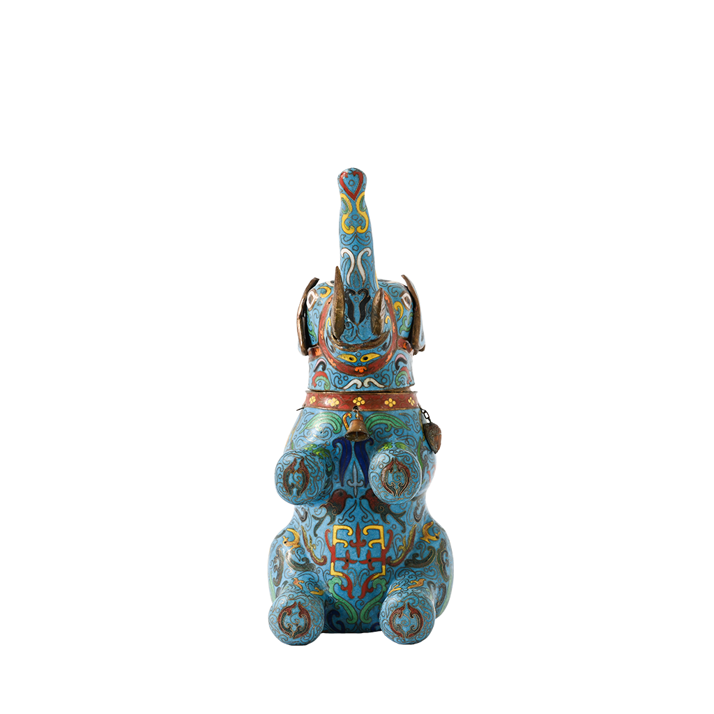 Decorative figurine of a stylized animal with intricate blue and gold patterns on a white background