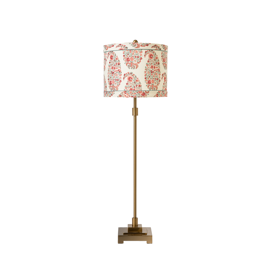 Decorative lamp with floral patterned shade on a white background