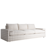 Light beige fabric sofa with geometric pattern, three seat cushions, and three rectangular back cushions.