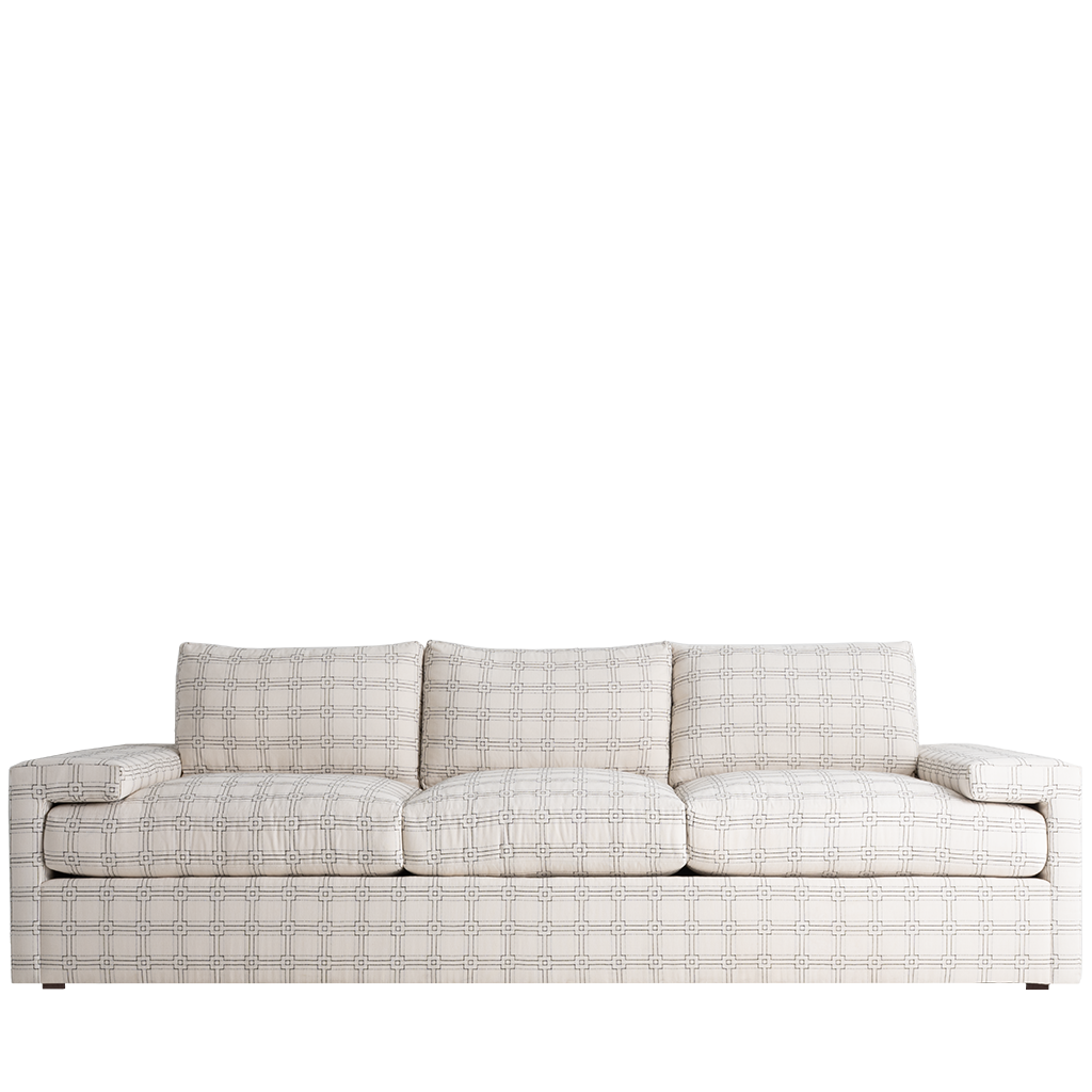 Light beige fabric sofa with subtle circular pattern, three seat cushions, and wide padded arms.