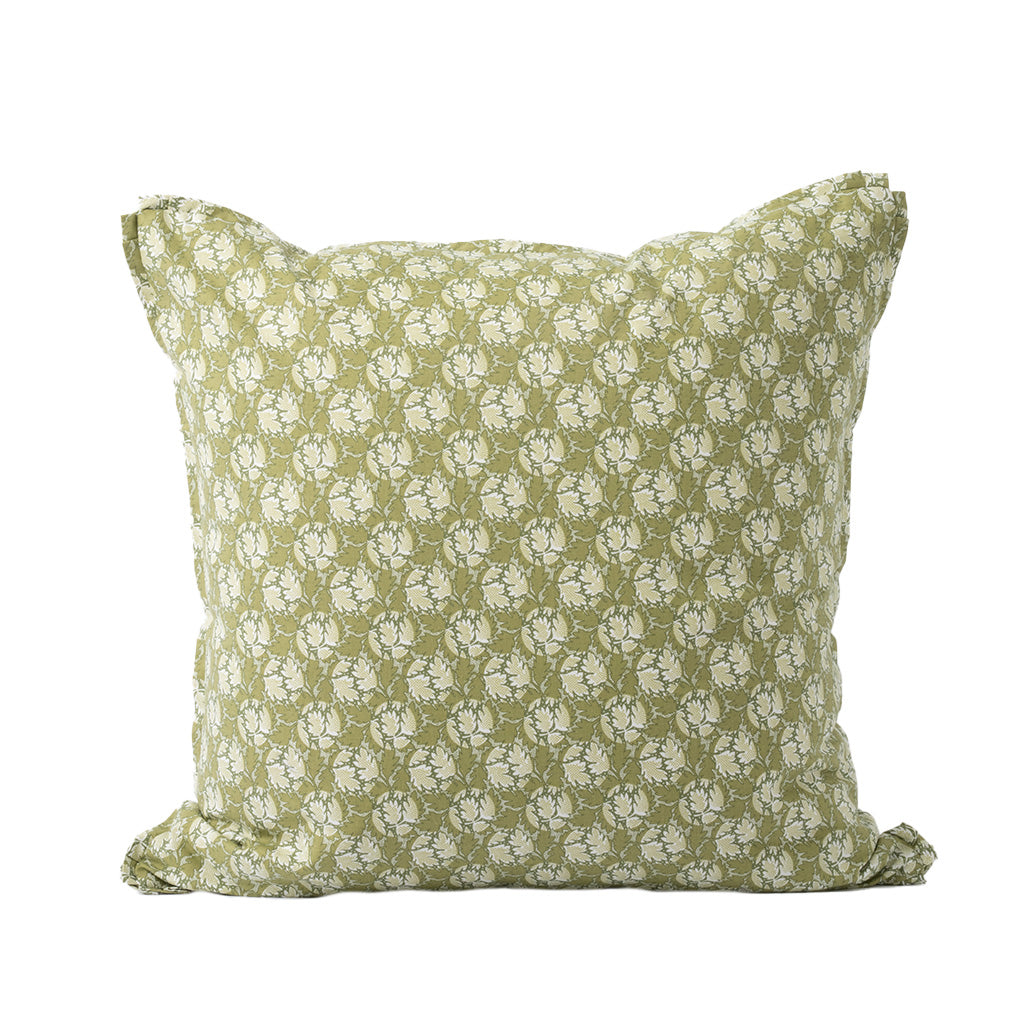 A square decorative throw pillow features an allover floral pattern in soft sage green and ivory. The delicate botanical print and muted color palette create a classic, cottage-inspired look.