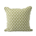 A square decorative throw pillow features an allover floral pattern in soft sage green and ivory. The delicate botanical print and muted color palette create a classic, cottage-inspired look.