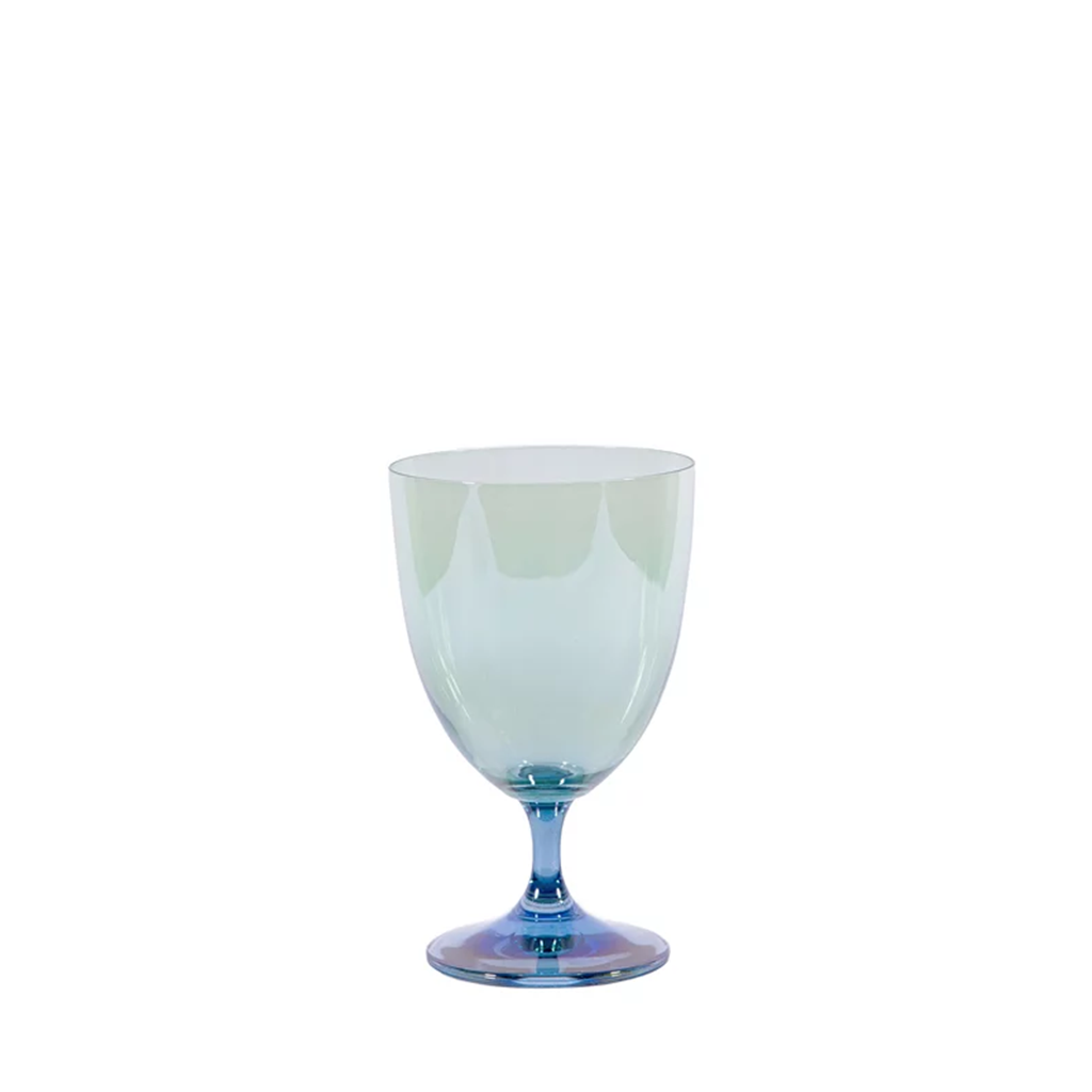 A blue and green ombre water glass with a smooth exterior and a play of color at the base.