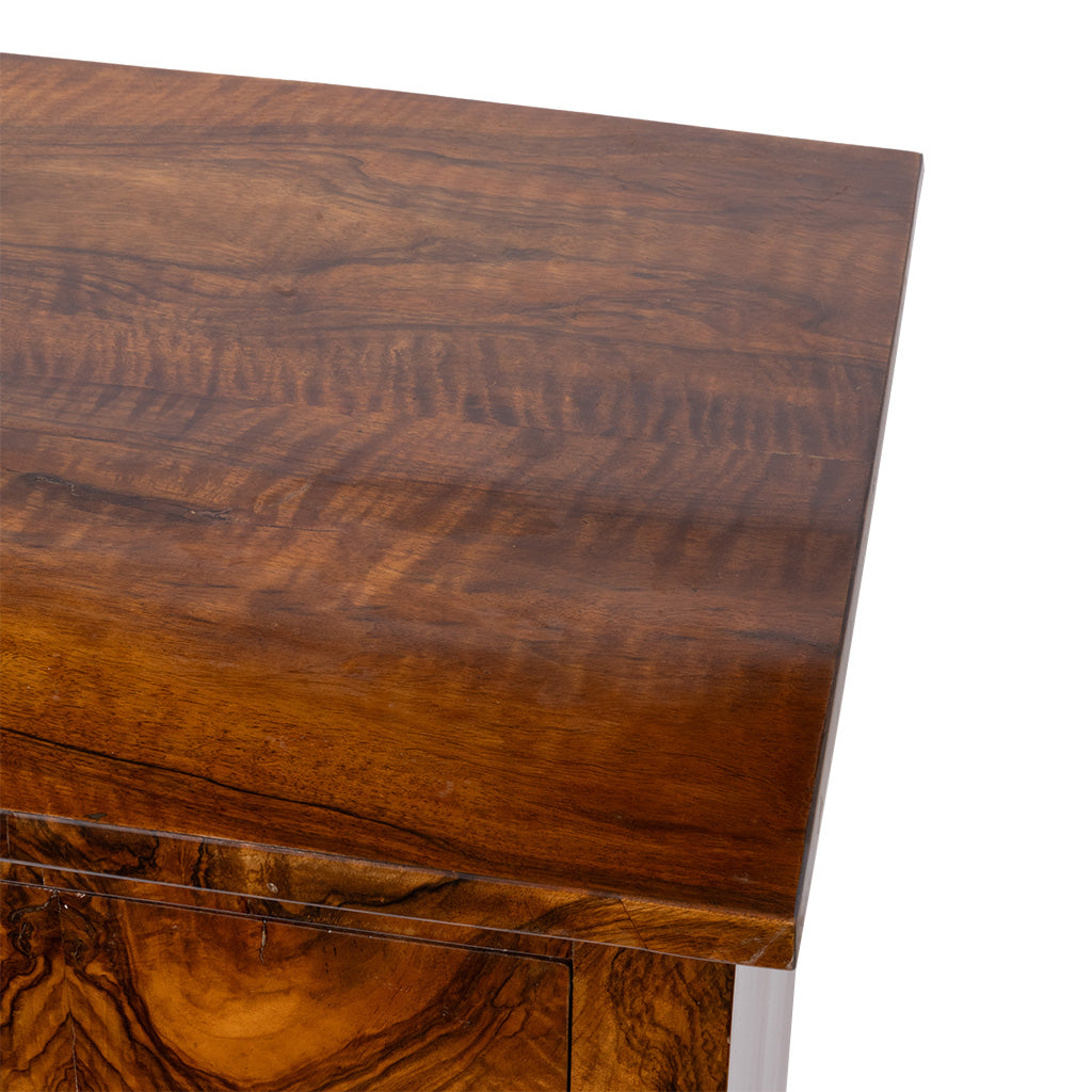 Close-up of a richly grained dark brown wood side table, showing the polished tabletop and wood grain against a white background.