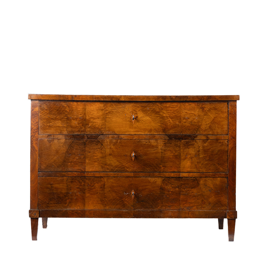 A three-drawer wooden chest of drawers with a rich warm brown finish and small round metal knobs, shown against a plain white background.