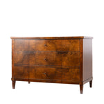A three-drawer wooden chest of drawers with a rich warm brown grain pattern and small round metal knobs, shown against a plain white background.