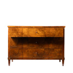 Front view of an antique Biedermeier chest of drawers with richly figured golden burl wood veneer across three graduated drawers. Simple keyhole escutcheons, tapered legs, and clean architectural lines emphasize the piece's elegant craftsmanship and striking natural wood grain.