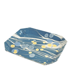 Hexagonal tray with blue and yellow marbled pattern on a white background
