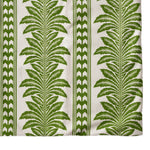 green and white tablecloth with palm tree pattern on a white background