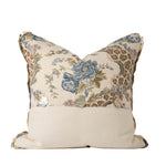 Back of the decorative pillow featuring the blue floral botanical print paired with a coordinating solid ivory fabric along the lower portion. Three decorative shell-style buttons accent the center closure for an elegant finishing detail.