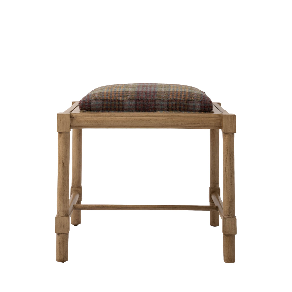 Hank Cocktail Table Ottoman featuring a natural wood frame topped with a cushioned seat upholstered in a rich rust, blue, and gold wool plaid. Four straight legs are connected by slender wood stretchers.