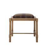 Hank Cocktail Table Ottoman featuring a natural wood frame topped with a cushioned seat upholstered in a rich rust, blue, and gold wool plaid. Four straight legs are connected by slender wood stretchers.