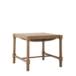 Hank Cocktail Table Ottoman shown with the cushioned top flipped over to reveal a smooth wood tabletop. The reversible design transforms the upholstered ottoman into a functional cocktail table.