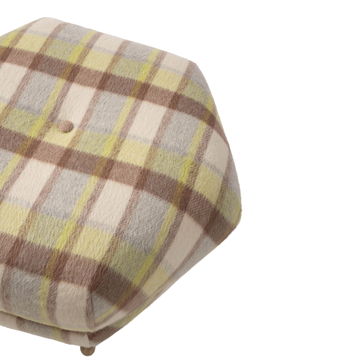 Close-up of the ottoman’s rounded cushion upholstered in a soft plaid fabric. Cream and taupe tones are accented with subtle pale green stripes for a classic, neutral pattern.