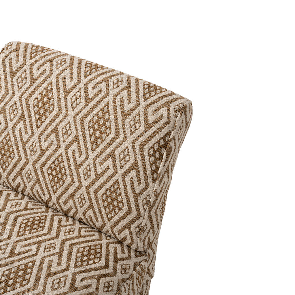 Close-up of the chair’s upholstery featuring an intricate geometric pattern in warm brown and cream. Repeating diamond and linear motifs create a richly textured, woven appearance.
