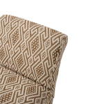 Close-up of the chair’s upholstery featuring an intricate geometric pattern in warm brown and cream. Repeating diamond and linear motifs create a richly textured, woven appearance.
