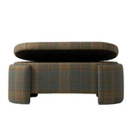 Front view of the upholstered plaid bench with its hinged seat lifted to reveal a hidden storage compartment. The bench features muted green, brown, and rust plaid upholstery with substantial rounded legs at each end.