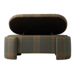 Front view of the upholstered plaid bench with its hinged seat lifted to reveal a hidden storage compartment. The bench features muted green, brown, and rust plaid upholstery with substantial rounded legs at each end.