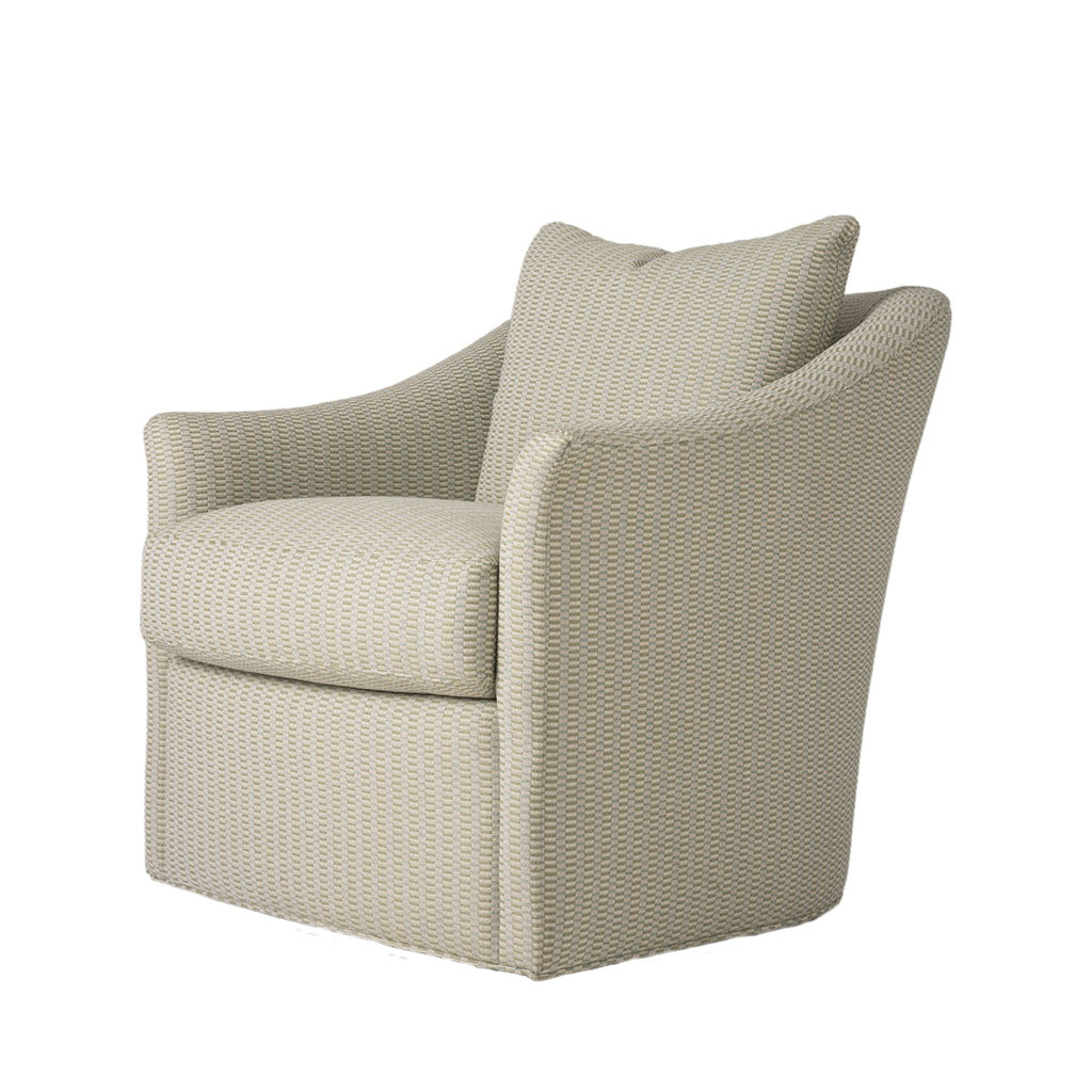 Three-quarter view of the cream upholstered armchair highlighting its gently curved arms, deep cushioned seat, and tailored silhouette. The textured neutral fabric gives the chair a soft, inviting appearance.