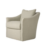 Three-quarter view of the cream upholstered armchair highlighting its gently curved arms, deep cushioned seat, and tailored silhouette. The textured neutral fabric gives the chair a soft, inviting appearance.