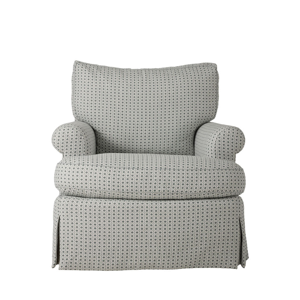 Plush upholstered armchair featuring a soft gray and cream small-scale geometric pattern. The chair has a generously cushioned back and seat, rounded arms, and a tailored skirted base.