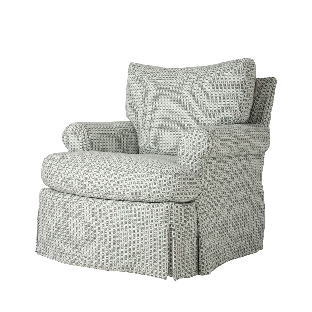 Three-quarter view of the armchair showing its plush back cushion, rounded arms, and deep seat. A subtle gray and cream geometric fabric covers the chair from top to bottom.
