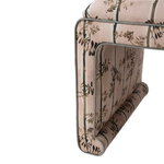 Close-up of a floral-patterned ottoman with a white background