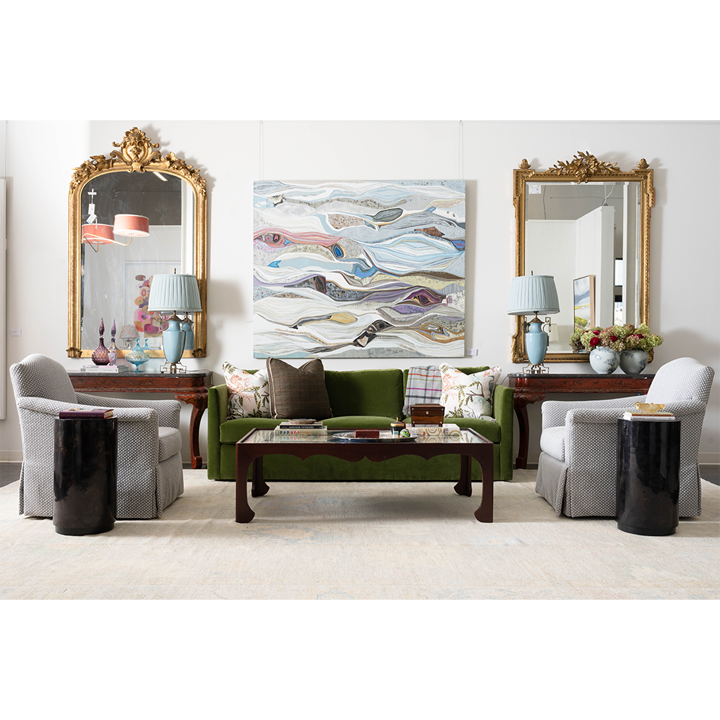 green couch, gold mirrors, grey chairs