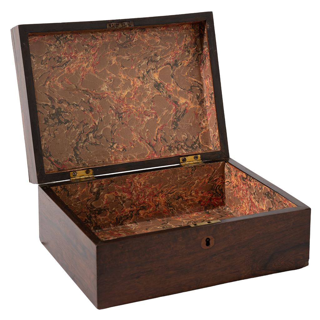 Wooden jewelry box with marbled interior on a white background