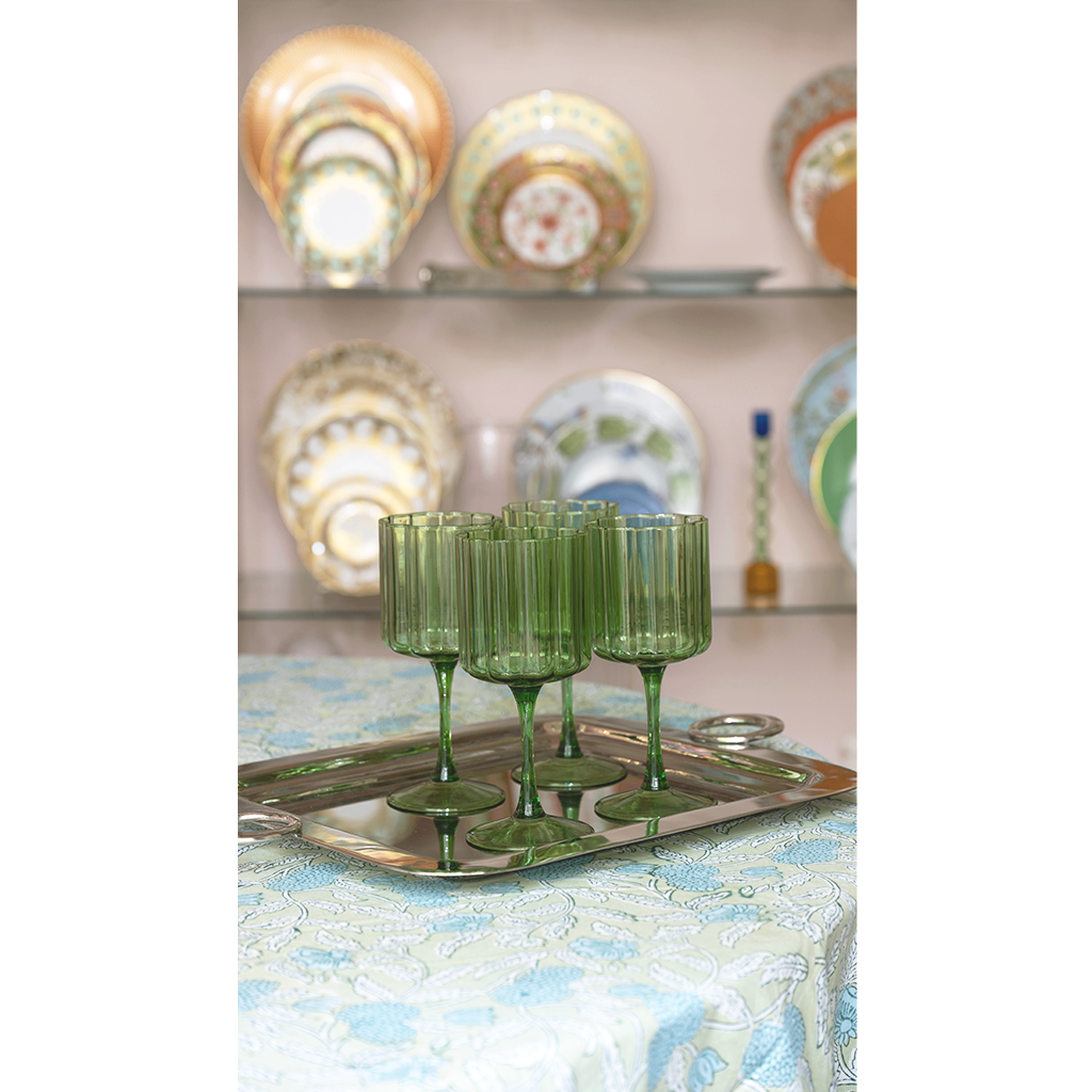 set of 4 green scalloped wine glasses on silver tray