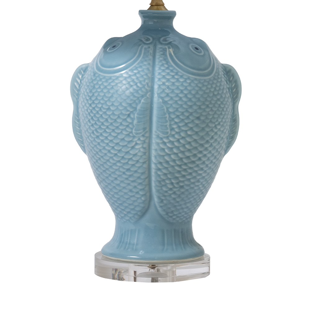 Blue ceramic lamp base with fish-scale pattern on a white background