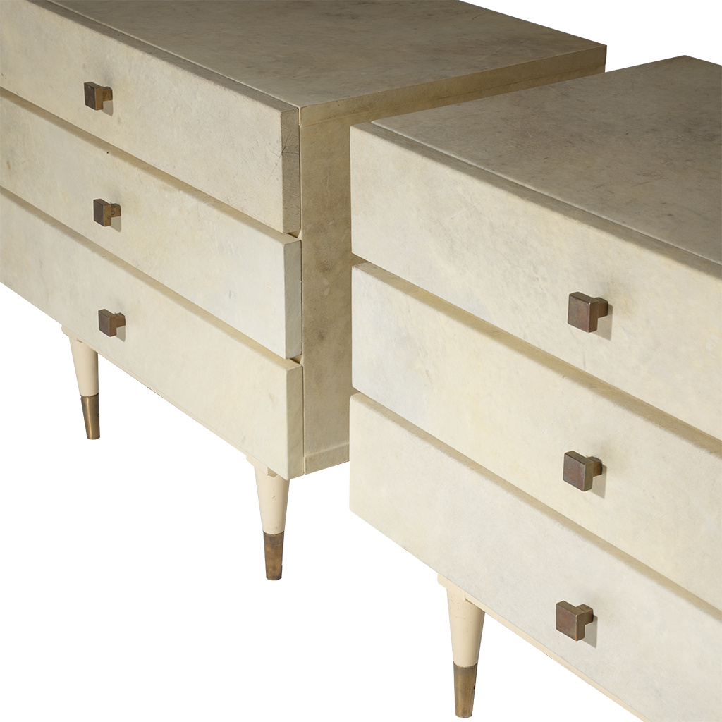 Pair of beige dressers with bronze handles on a white background