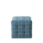 Blue checkered ottoman on a white background