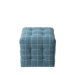 Blue checkered ottoman on a white background