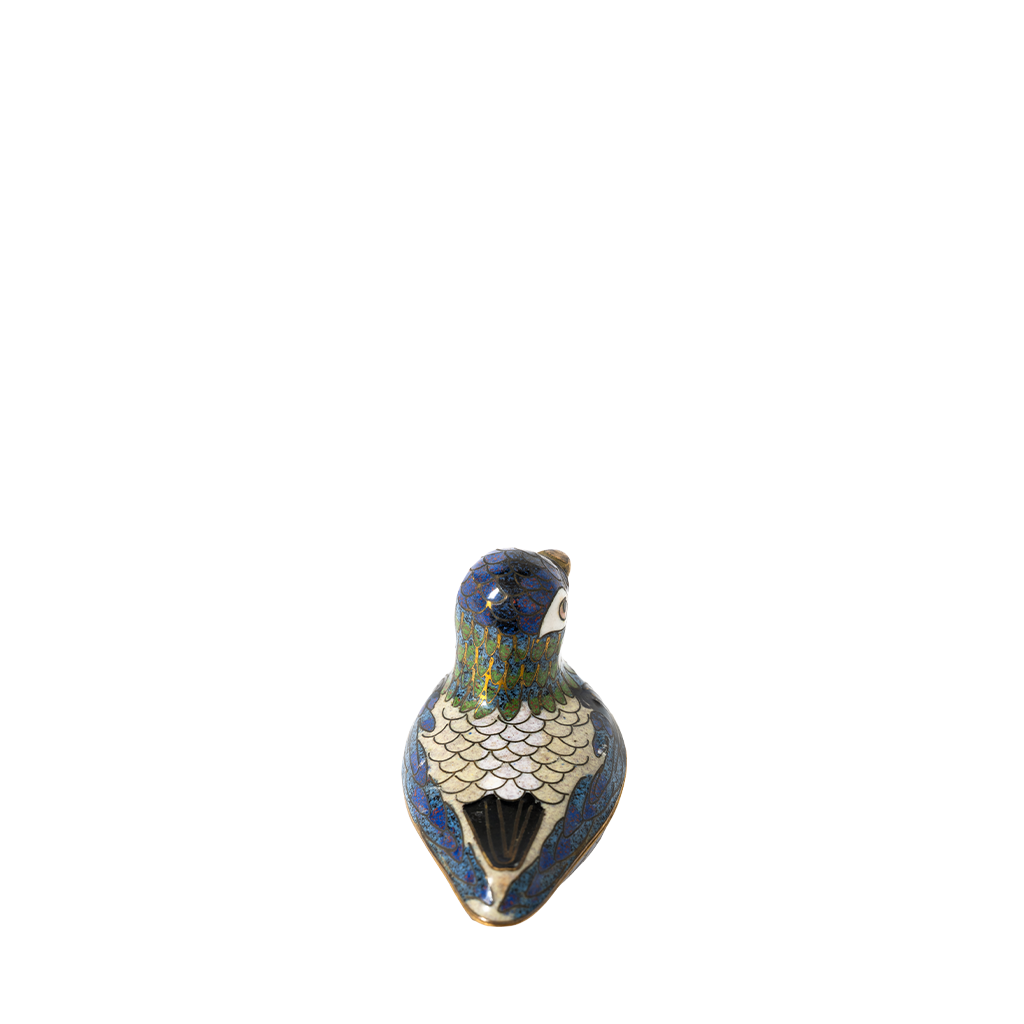 Decorative cloisonné bird figurine on a white background