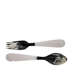 Set of black and white patterned spoon and fork on a white background