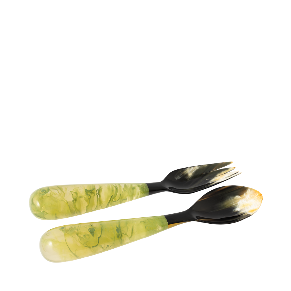 Two spoons with green and black marbled handles on a white background