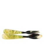 Two marbled patterned spoons on a white background