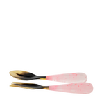 Set of two spoons with pink and black handles on a white background