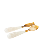 Two wooden spoons with white handles on a white background