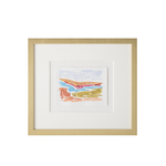 A framed abstract landscape art print with a white mat and a light natural wood frame, shown against a plain white background.