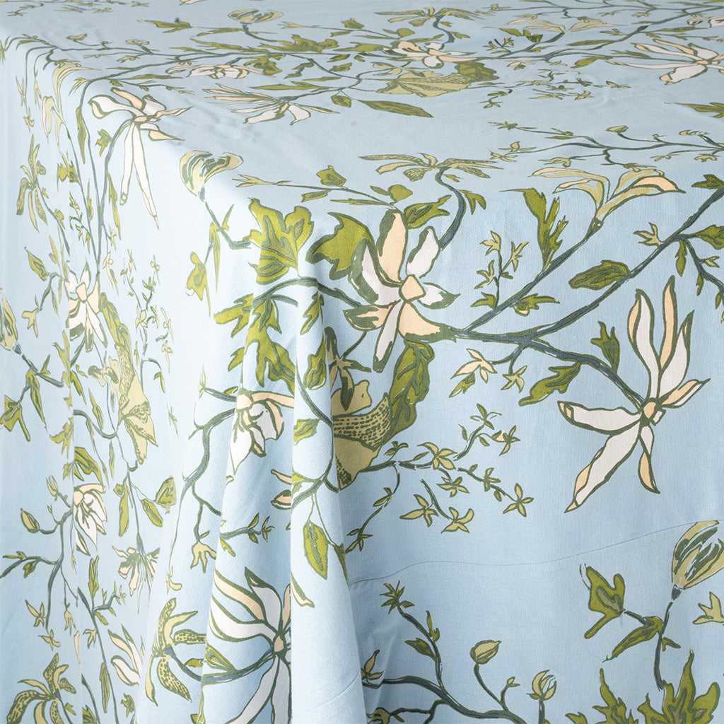 close up image of a blue and green botanical tablecloth