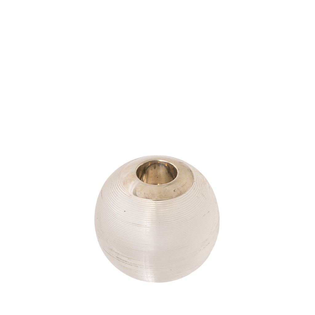 A small, round, ribbed glass match holder with a metallic silver-toned interior, shown on a plain white background.